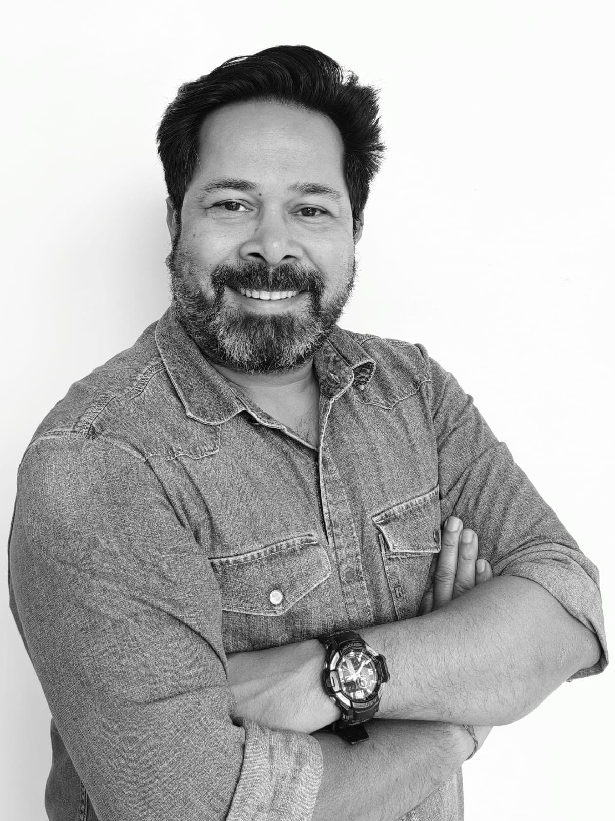 Anirudh Singh, founder of Unbordr, in a black-and-white studio portrait